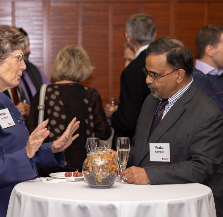 A photo of people talking or laughing at the Alumni Awards event