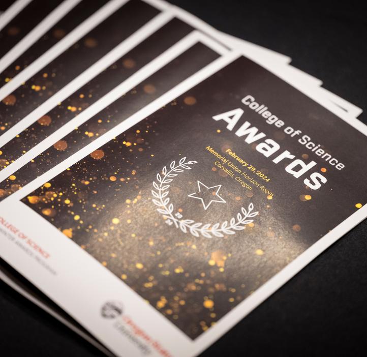 An array of the 2024 College of Science Awards pamphlets lay out on the table at Oregon State University..